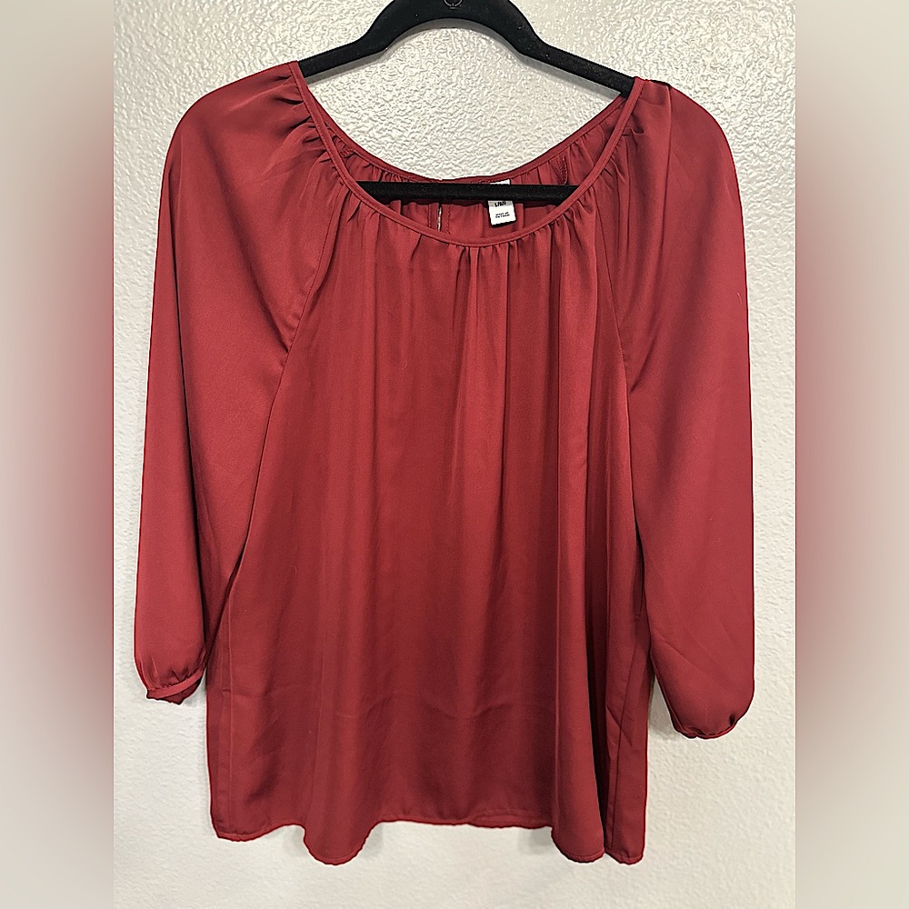3/4 Sleeve Maroon blouse with keyhole button closure on back.